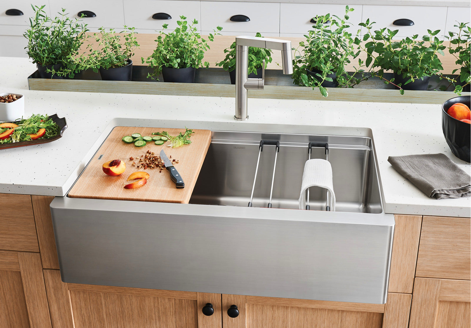 Blanco 33" Quatrus Workstation Kitchen Sink in kitchen with optional accessories